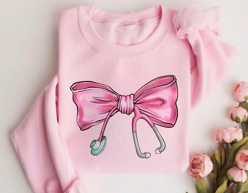 Coquette Nurse Stethoscope Bow Sweatshirt, Nurse Graduation Gift, Bow Oversized Shirt, Nurse Appreciation Gift, Christmas...
